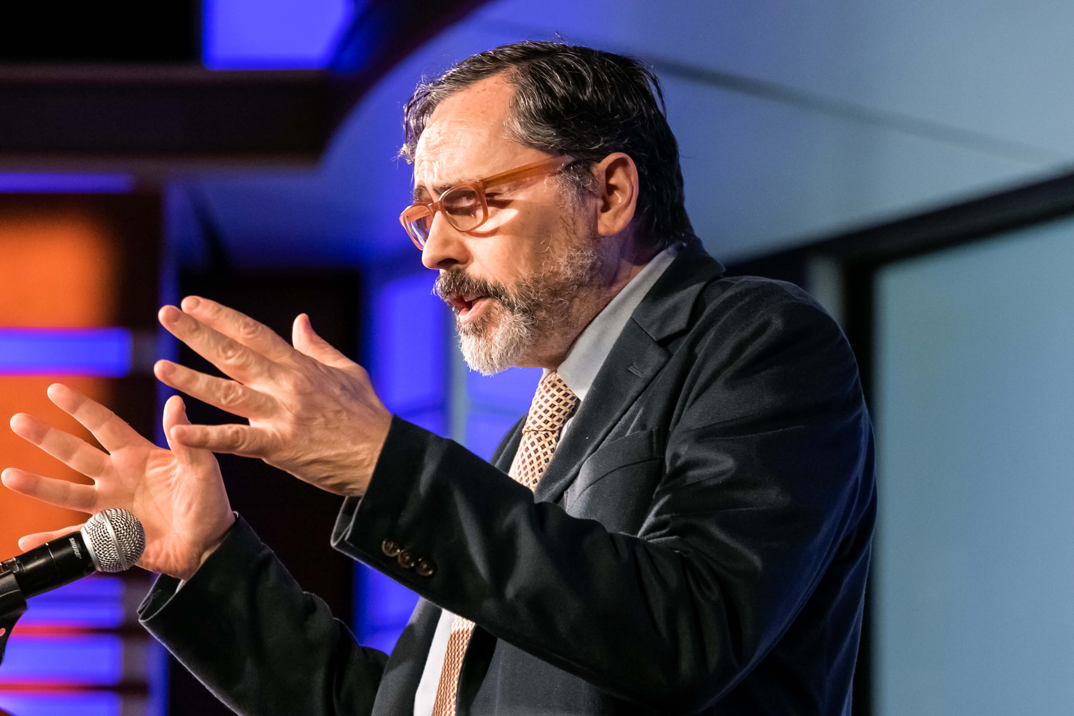 Aurelien Portuese speaks on stage with FTC commissioner, Mark Meador