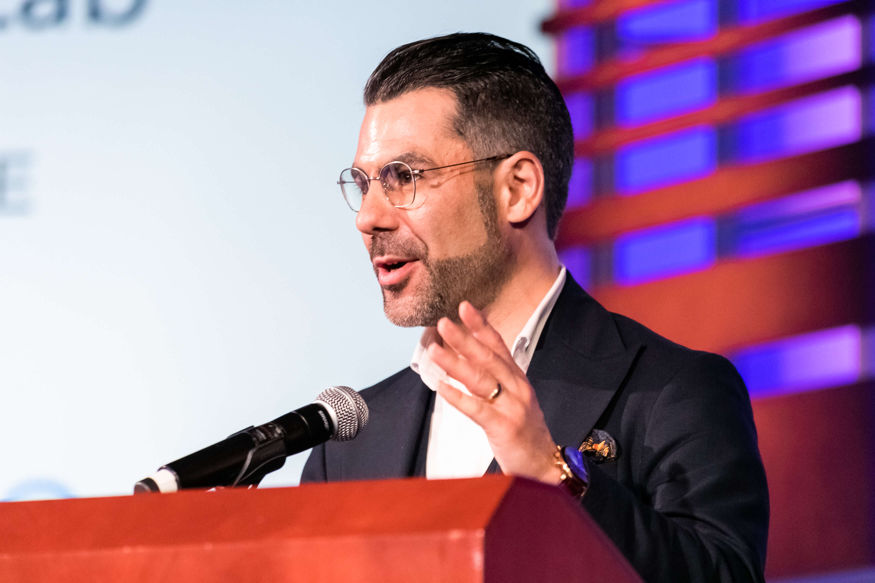 Aurelien Portuese speaks on stage with FTC commissioner, Mark Meador