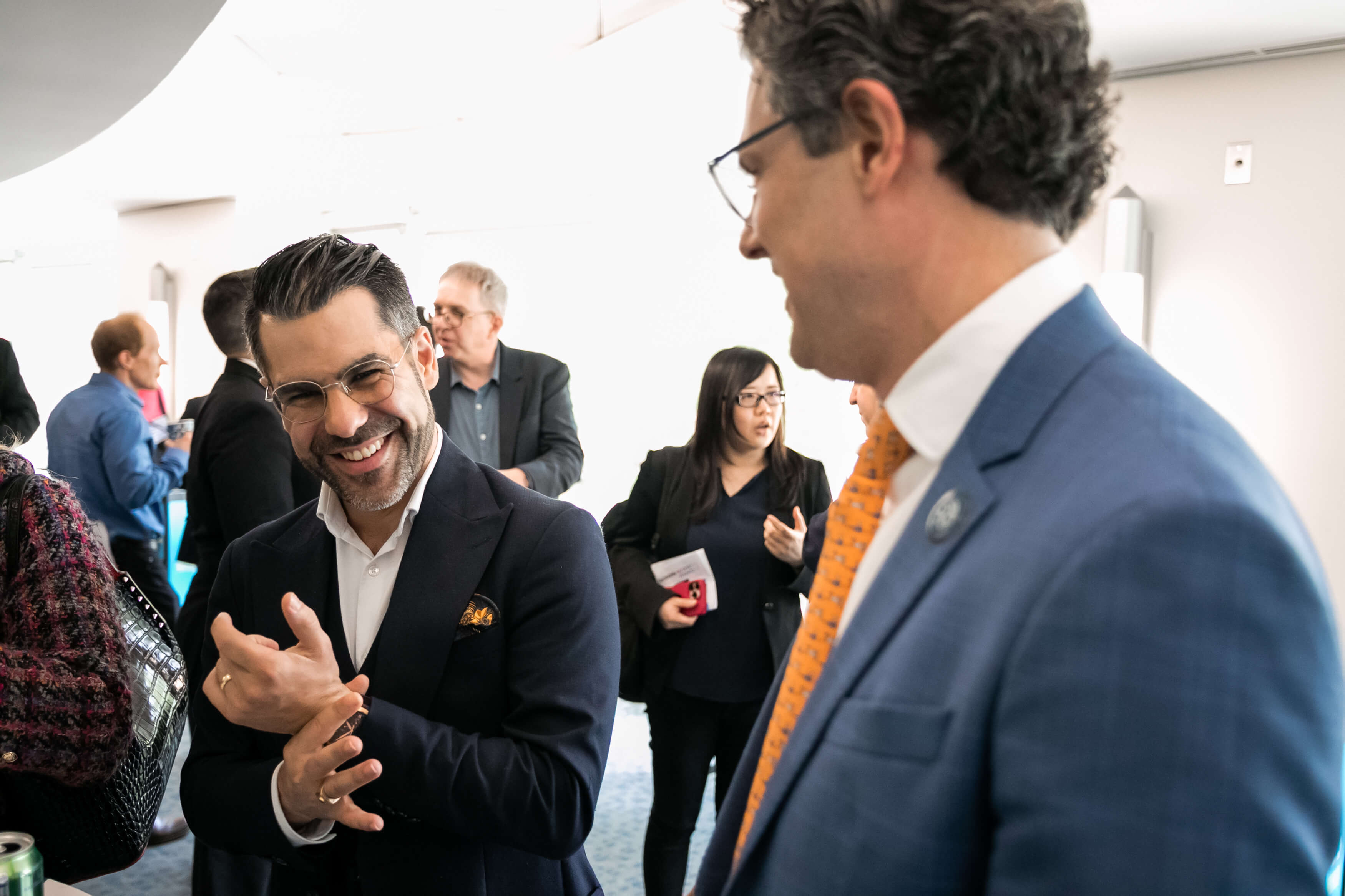 Aurelien Portuese speaks on stage with FTC commissioner, Mark Meador