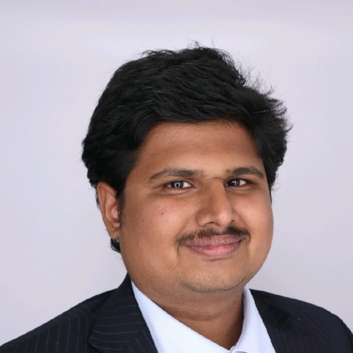 Headshot of Kartik Kundeti wearing a suit