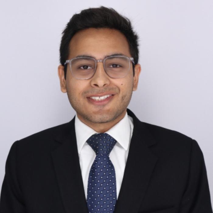 Headshot of Rafay Raza wearing a suit