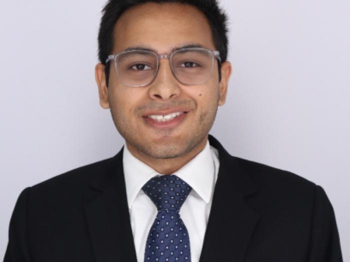 Headshot of Rafay Raza wearing a suit