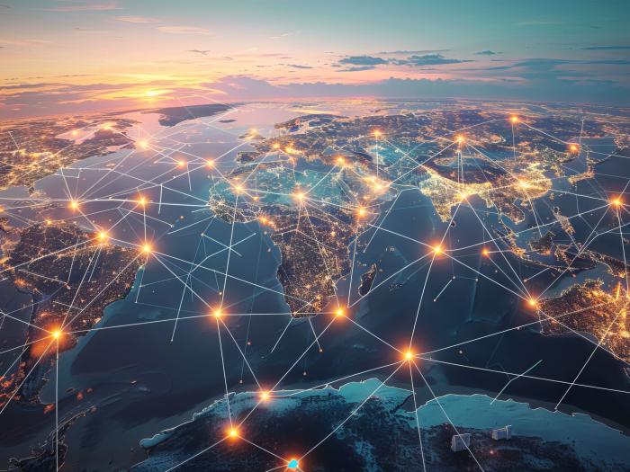 connected lights are overlaid on top of the globe to display global interconnectedness 